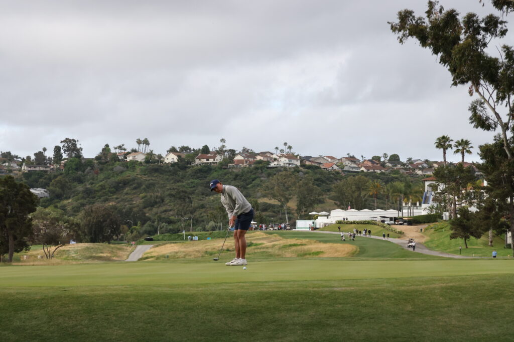 Virginia's George Duangmanee putts for birdie on his first role of Round 2. 