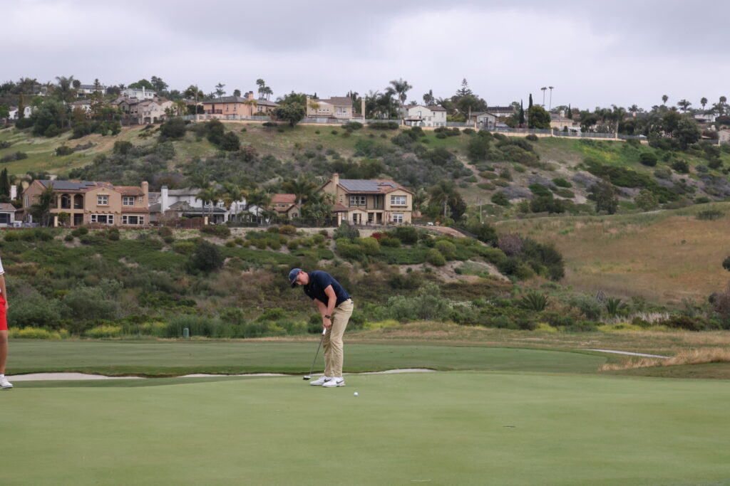 Virginia's Ben James putts for birdie on his 18th hole, Hole #9.