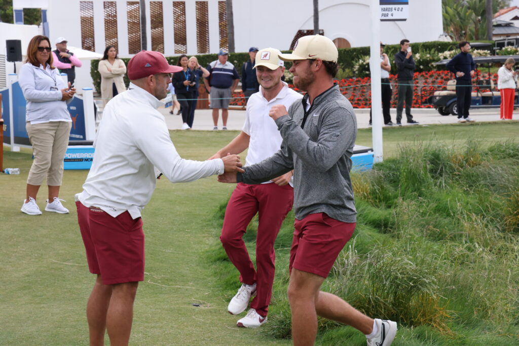 Florida State coach congratulates players as they advance to the Finals.