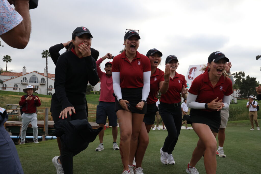 The Stanford women's golf team runs to Heck to celebrate their NCAA Championship win.