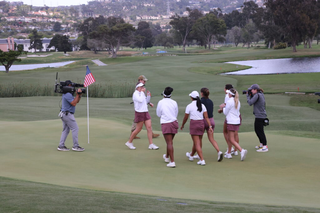 Adela Cernousek's Texas A&M teammates congratulate her on her win. Kelly Okun, Fairway to Green.