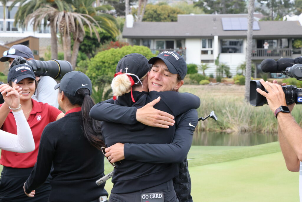 Stanford Coach Anne Walker and senior Rachel Heck embrace after an emotional win.