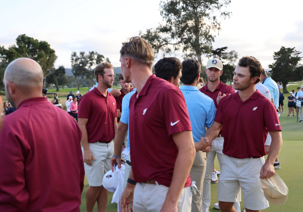 Florida State shakes Auburn's hands after a close match for the national title.