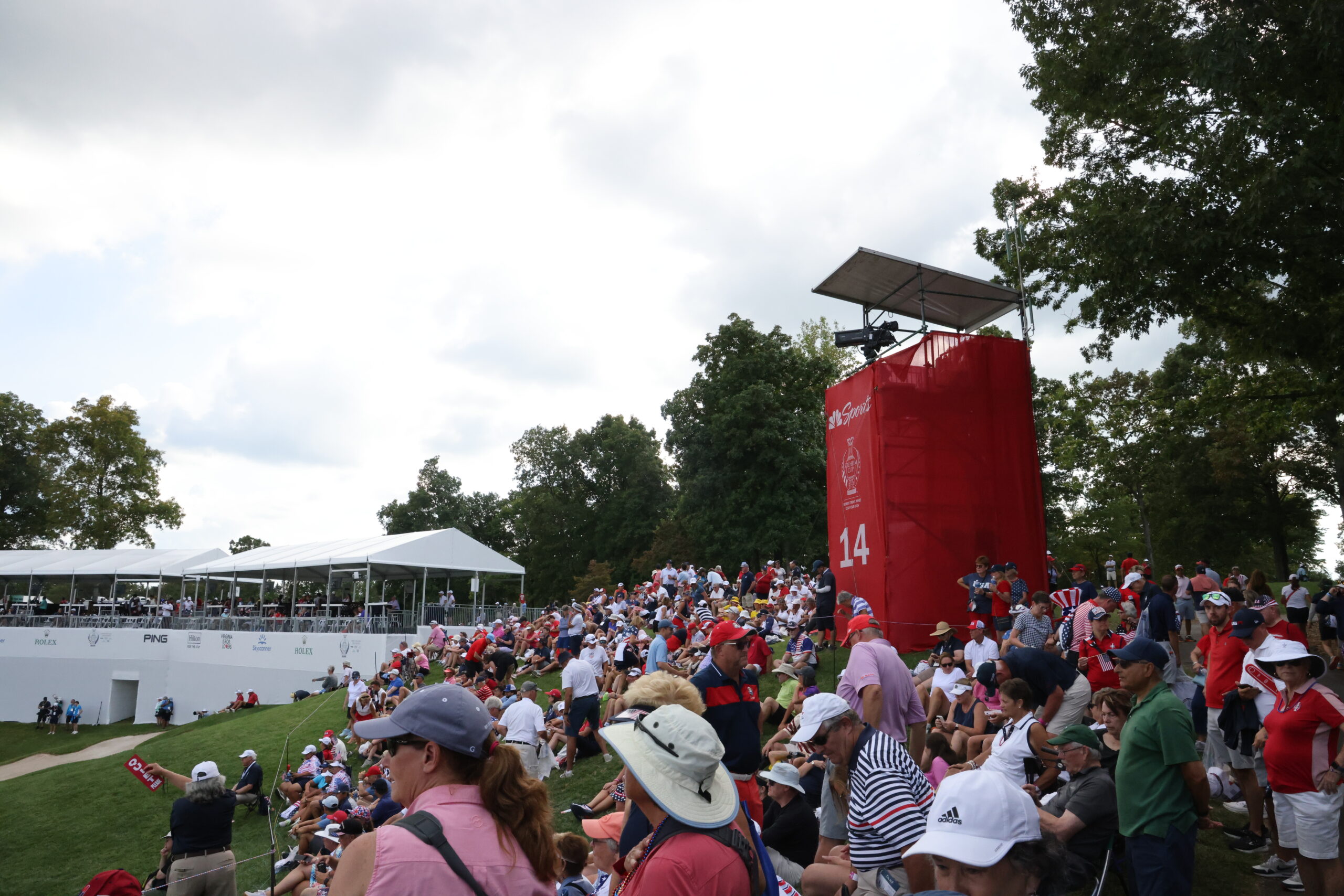 Golf fans crowd around the 14th green at the Solheim Cup on Friday afternoon.