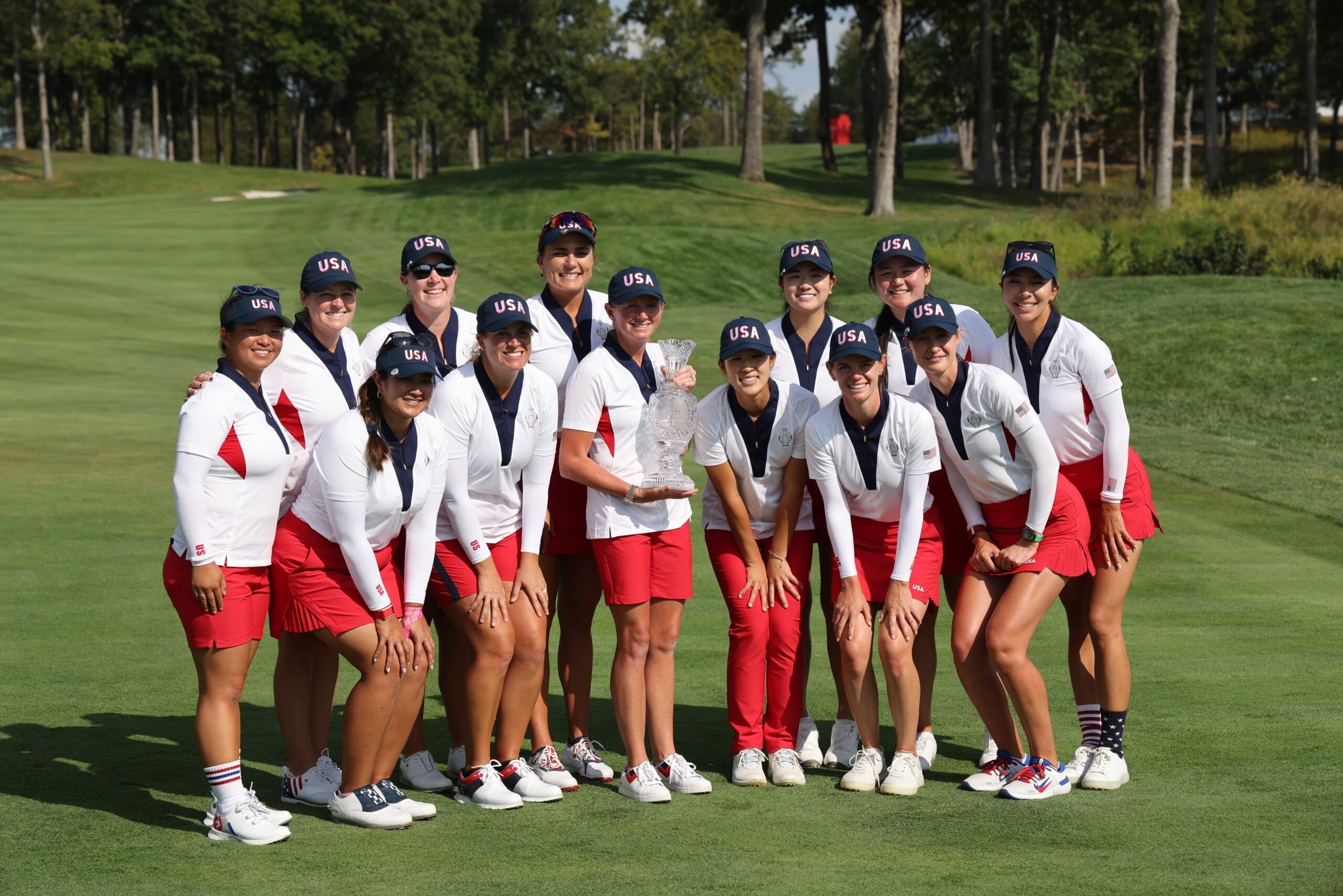 Team USA poses with the Solheim Cup after a 15.5- vs. 12.5-point win.