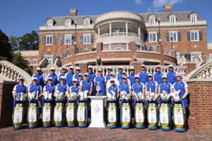 2024 Solheim Cup Team Europe poses with their golf bags and caddies.