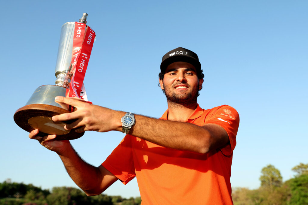 Eugenio Chacarra of Spain celebrates with the trophy following his victory at the Hero Indian Open 2025.