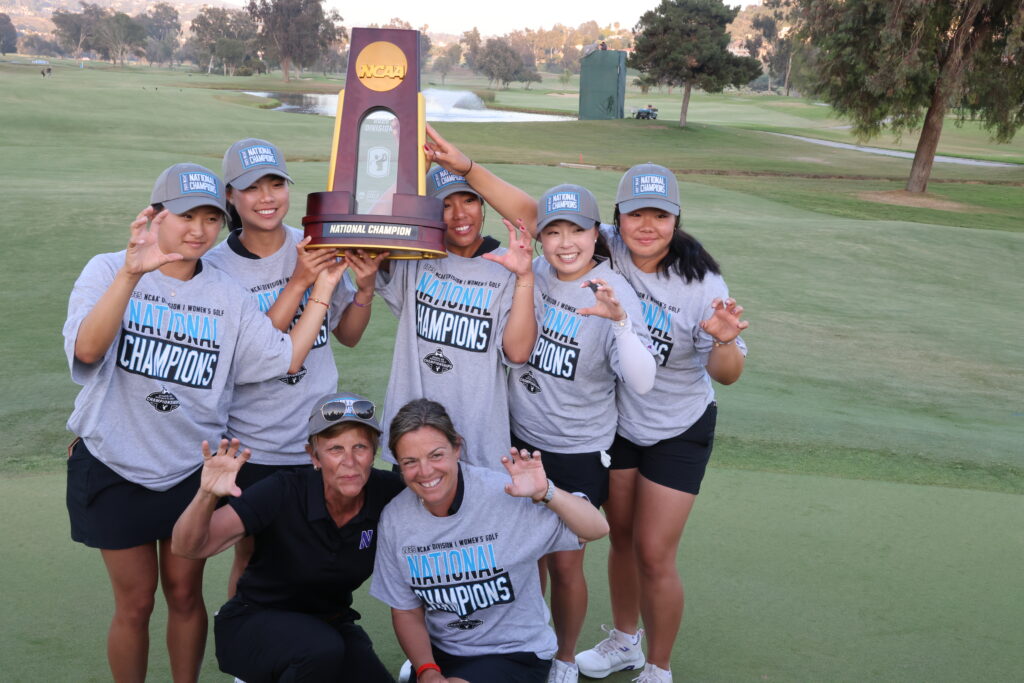 The Wildcats show their claws on the 18th green after being awarded the coveted NCAA trophy.