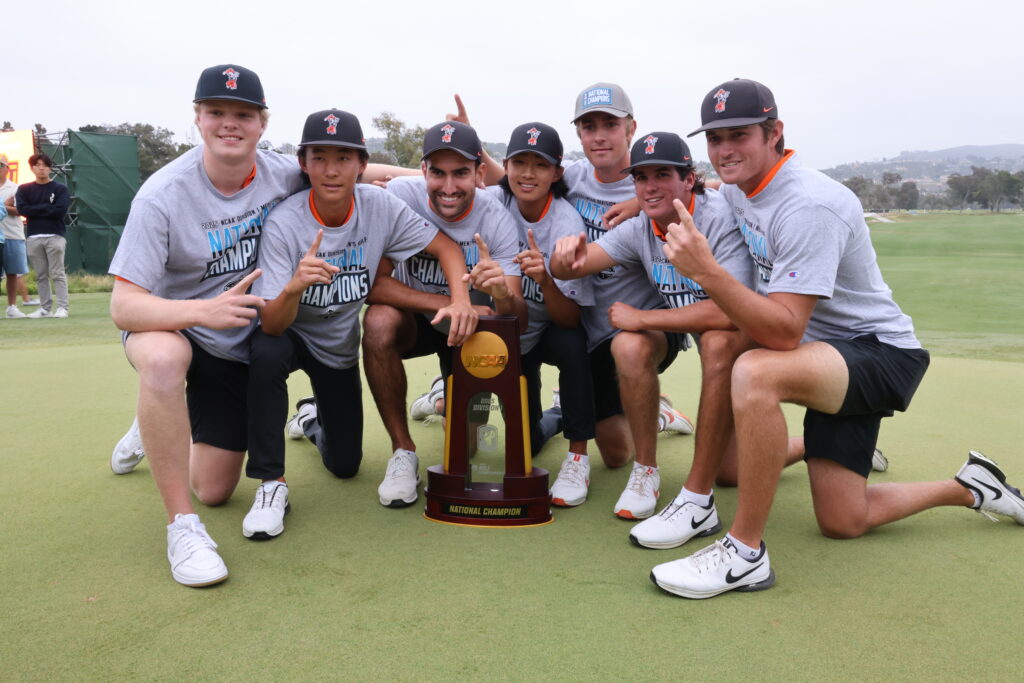 The Oklahoma State Cowboys pose with the NCAA Championship trophy.