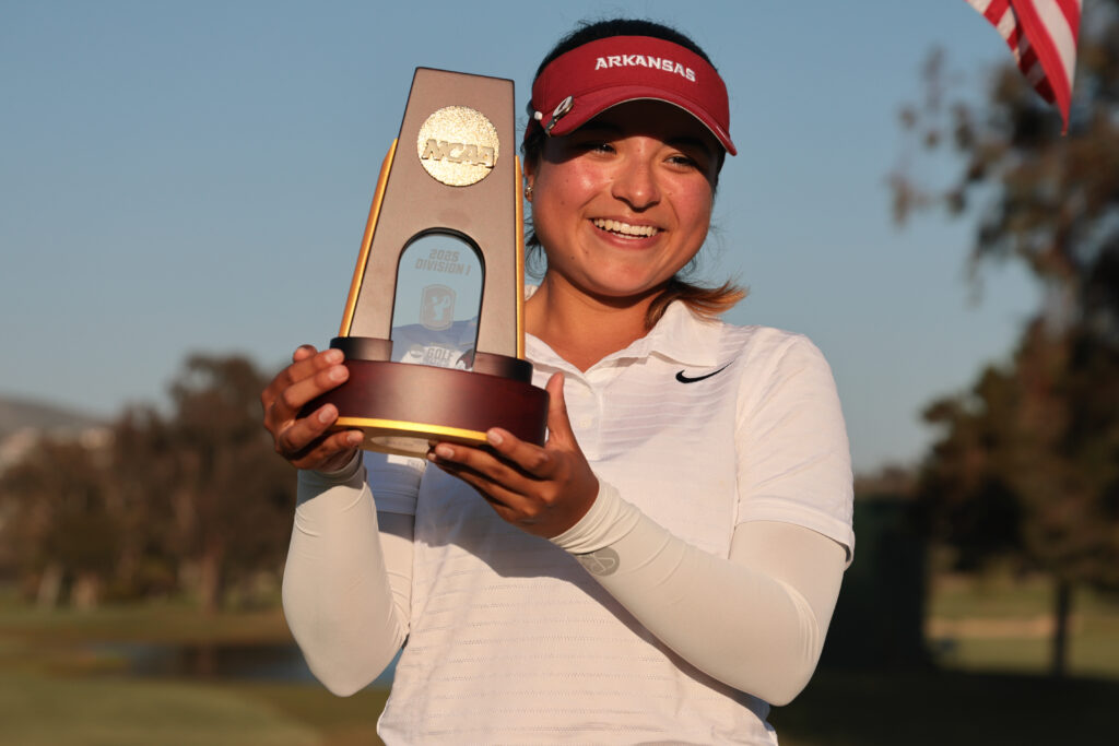 Maria José Marin of the Arkansas Razorbacks celebrates with the stroke play national champion trophy during the fourth round of the Division I Women’s Golf Championship.