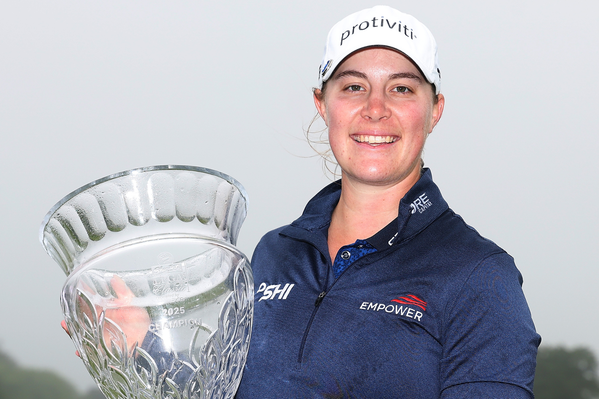 Jennifer Kupcho poses with the trophy after winning the ShopRite LPGA Classic.