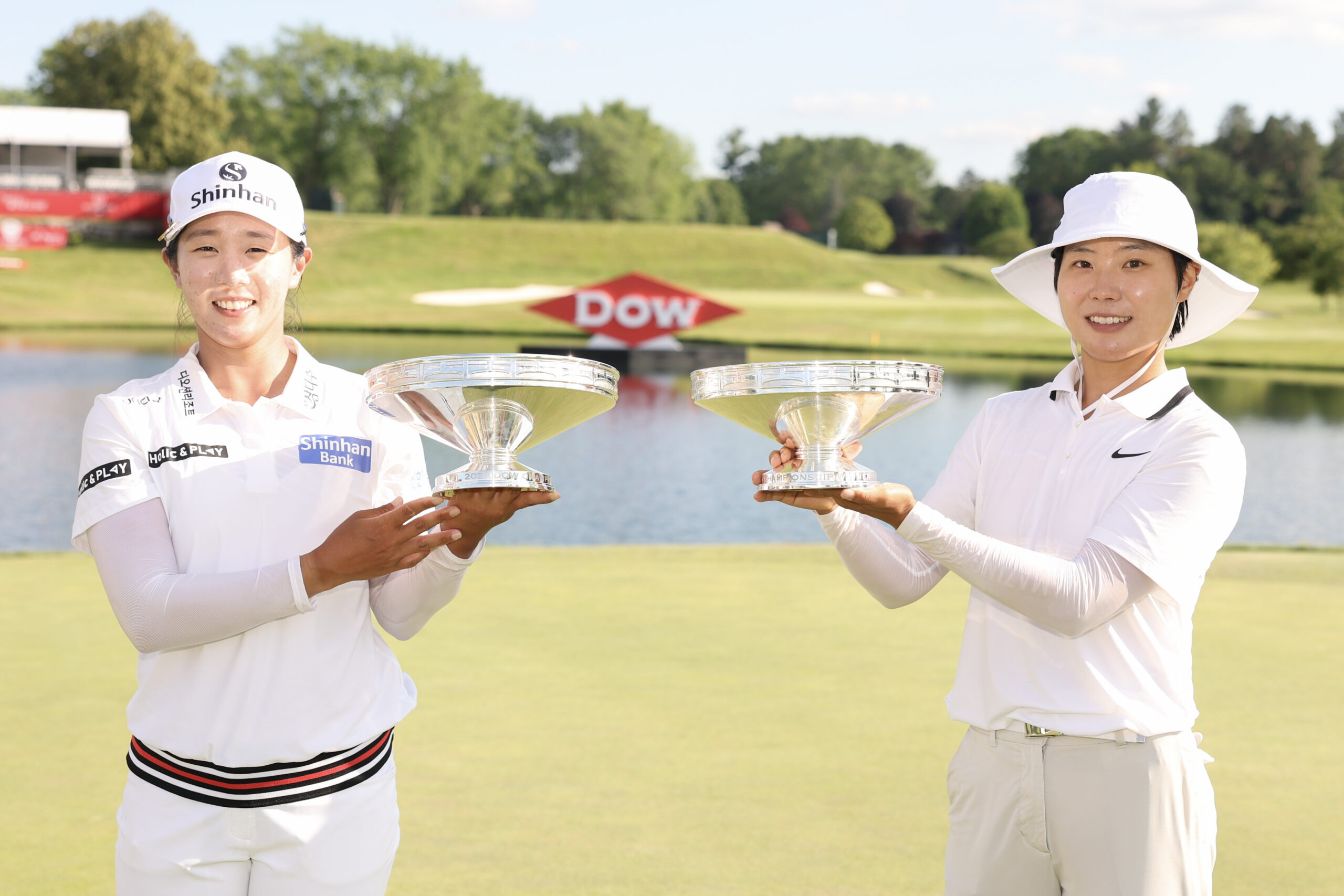 Jin Hee Im and Somi Lee of South Korea pose with their trophies after the final round of the Dow Championship 2025 at Midland Country Club.