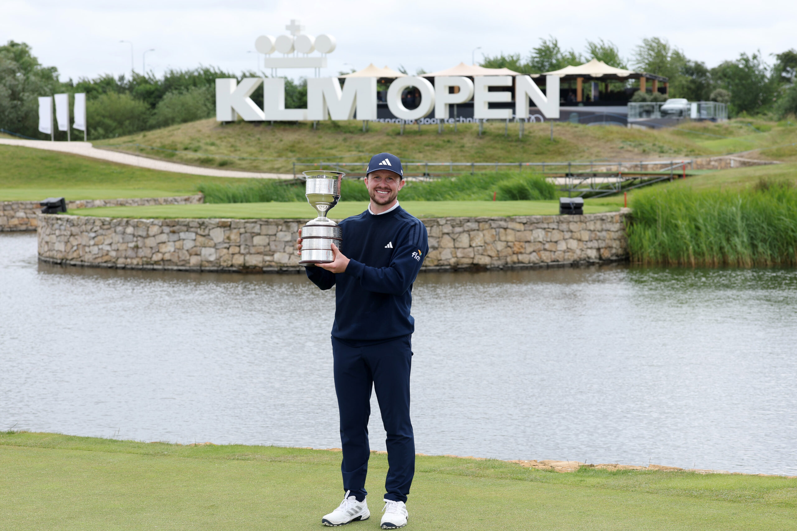 Connor Syme of Scotland poses with the trophy after winning the KLM Open.