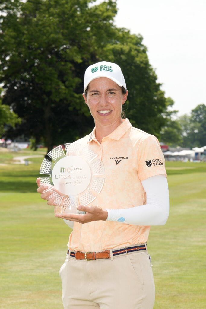Carlota Ciganda poses for a photo with the trophy after winning the Meijer LPGA Classic for Simply Give 2025.