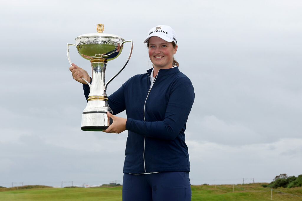 Lottie Woad poses with the trophy following victory of the ISPS HANDA Women's Scottish Open.