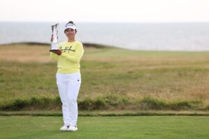 Miyu Yamashita of Japan lifts the AIG Women's Open trophy following victory in the final round at Royal Porthcawl.