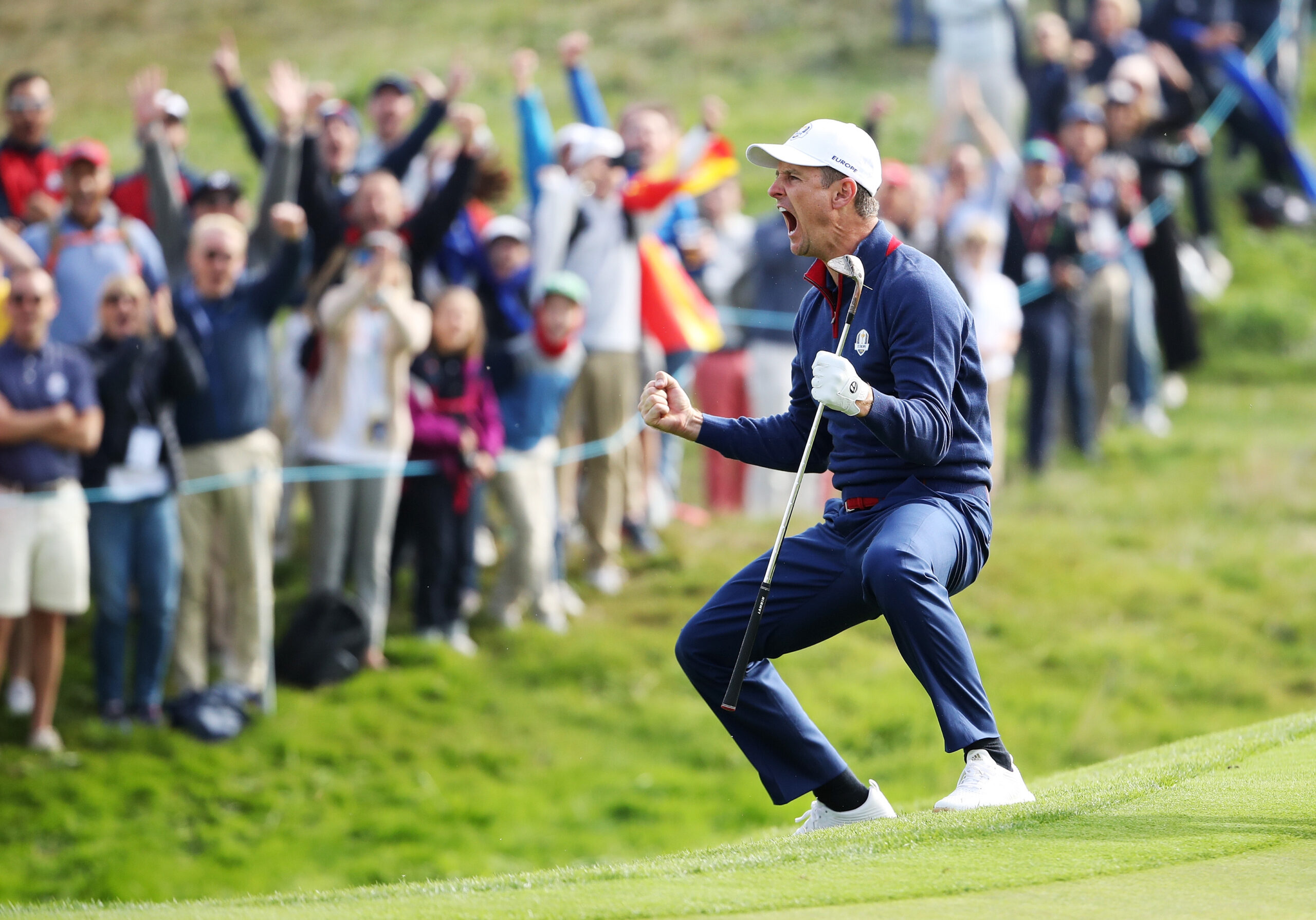 Justin Rose of Team Europe celebrates chipping in on the 12th during the morning fourball matches of the 2018 Ryder Cup at Le Golf National.