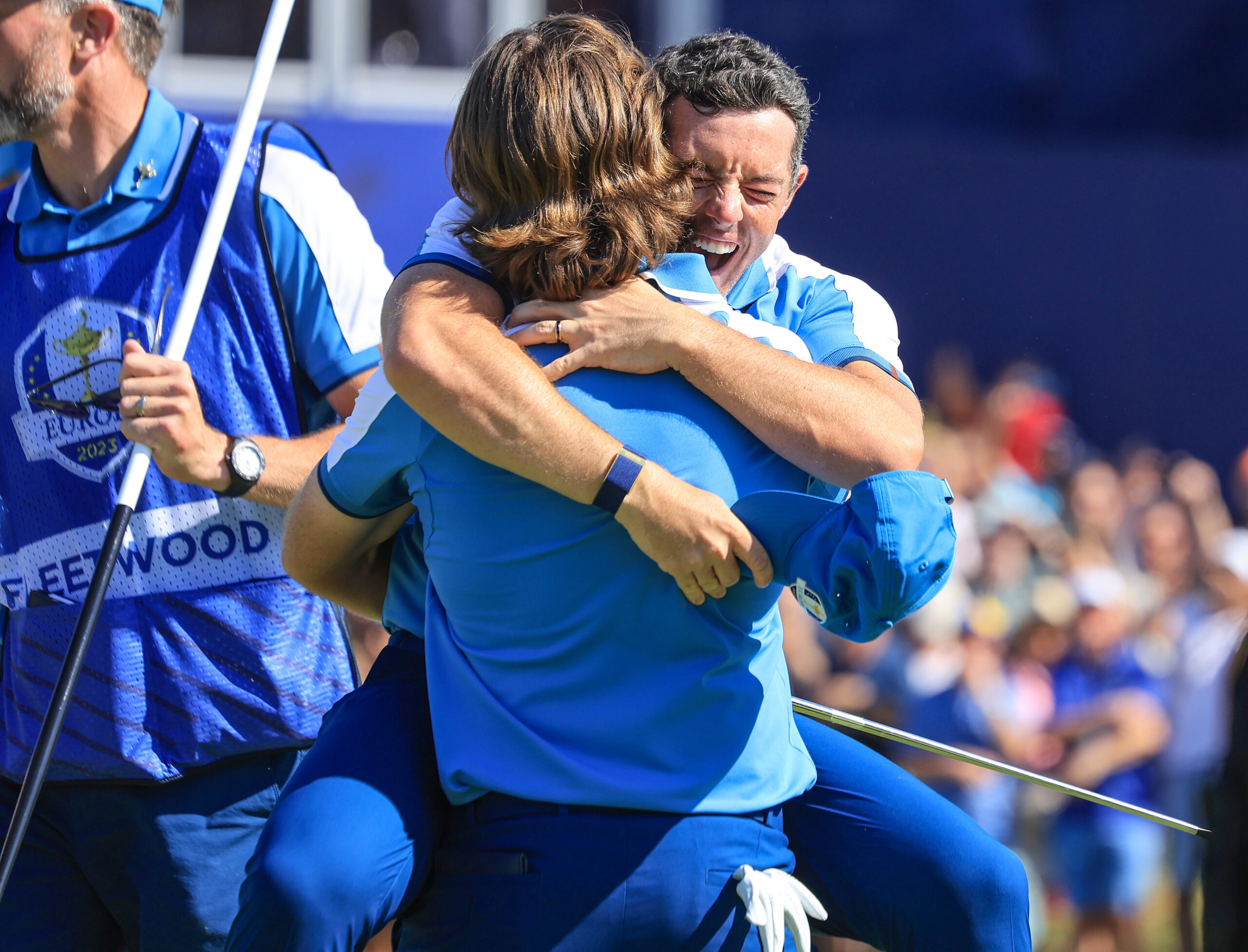 Rory McIlroy leaps into the arms of his partner Tommy Fleetwood after they had won their match on the 17th green against Xander Schauffele and Patrick Cantlay during the Friday morning foursomes matches of the 2023 Ryder Cup.