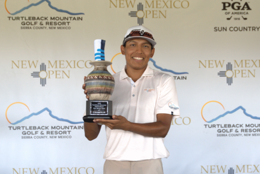 Aidan Thomas hoists the New Mexico Open trophy after winning in his first professional start.