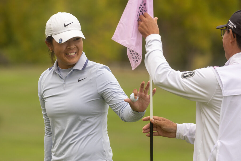 Canada's Anna Huang waves during the final round.