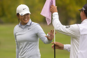 Canada's Anna Huang waves during the final round.