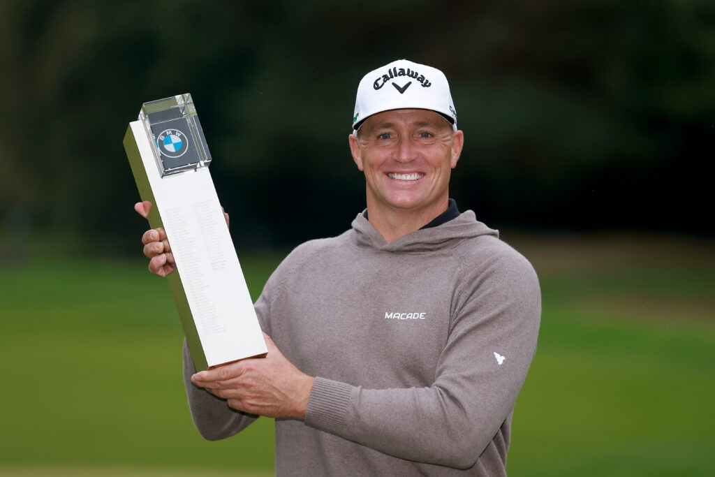 Alex Noren of Sweden poses with the BMW PGA Championship trophy on the 18th green after winning the playoff at the 2025 BMW PGA Championship.