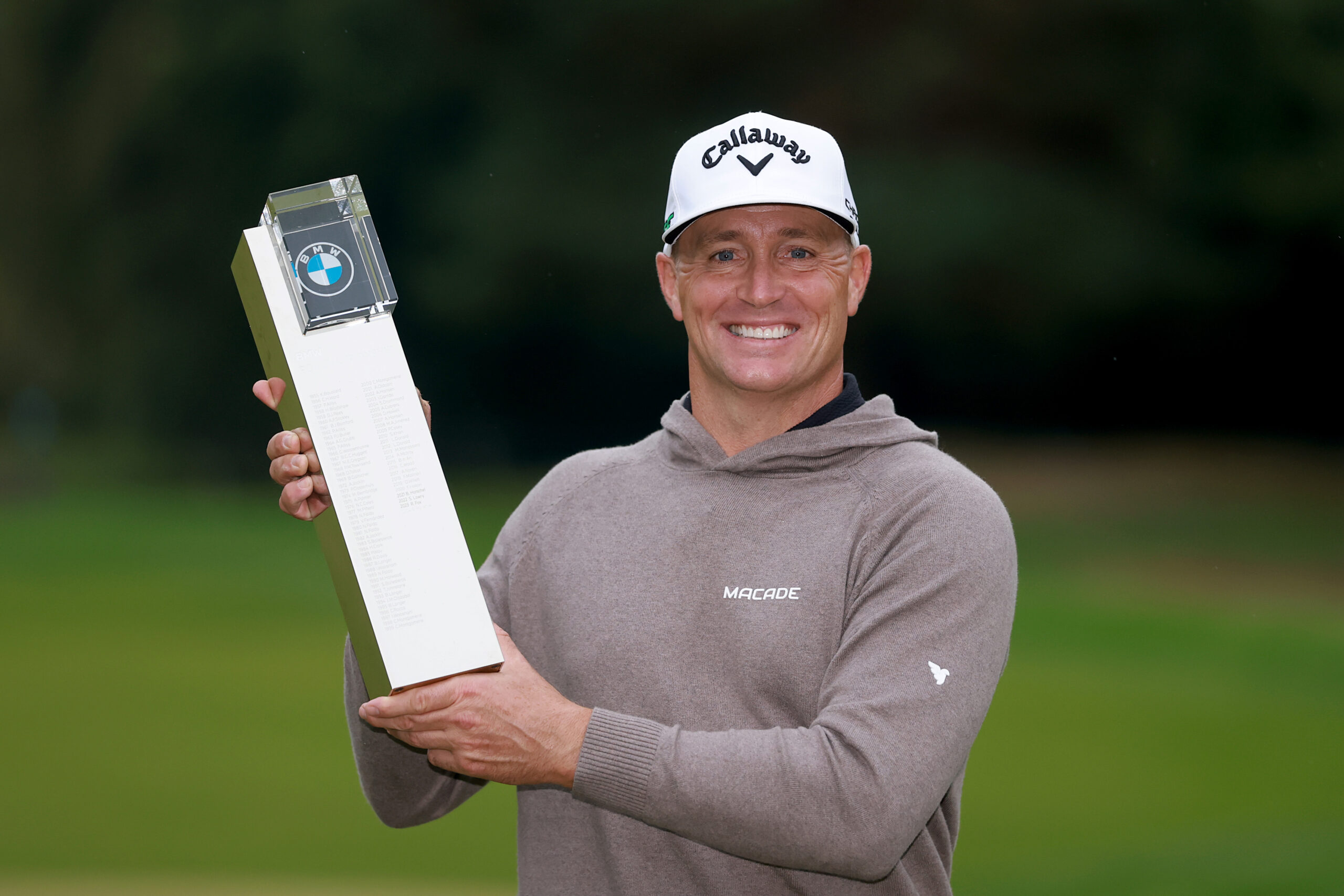 Alex Noren of Sweden poses with the BMW PGA Championship trophy on the 18th green after winning the playoff at the 2025 BMW PGA Championship.