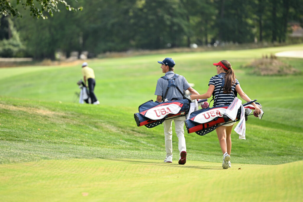 Asterisk Talley and Miles Russell of Team United States walk to the tenth hole during the second round of the 2025 Junior Ryder Cup at Nassau Country Club.