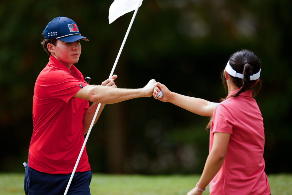 Luke Colton and Anna Fang interact on the second hole during the third round of the 2025 Junior Ryder Cup.