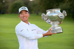 Michael Kim poses with the trophy following victory on day four of the 2025 FedEx Open de France in Paris.