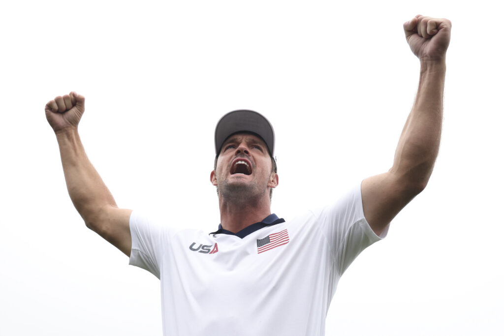 Bryson DeChambeau of Team United States pumps up the crowd during the 2025 Ryder Cup Practice Round on the Black Course at Bethpage.