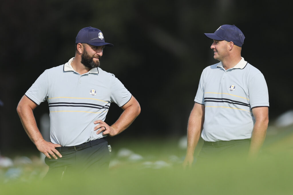 Jon Rahm and Sepp Straka of Team Europe talk on the 12th hole during the 2025 Ryder Cup.