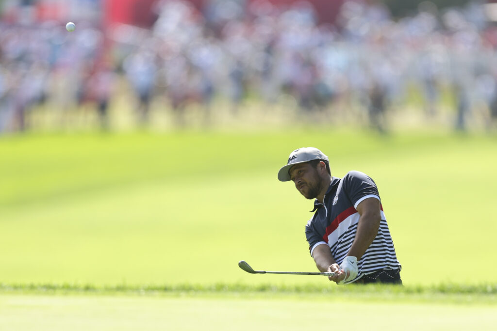 Xander Schauffele of Team United States hits his shot on the 15th hole during the 2025 Ryder Cup.