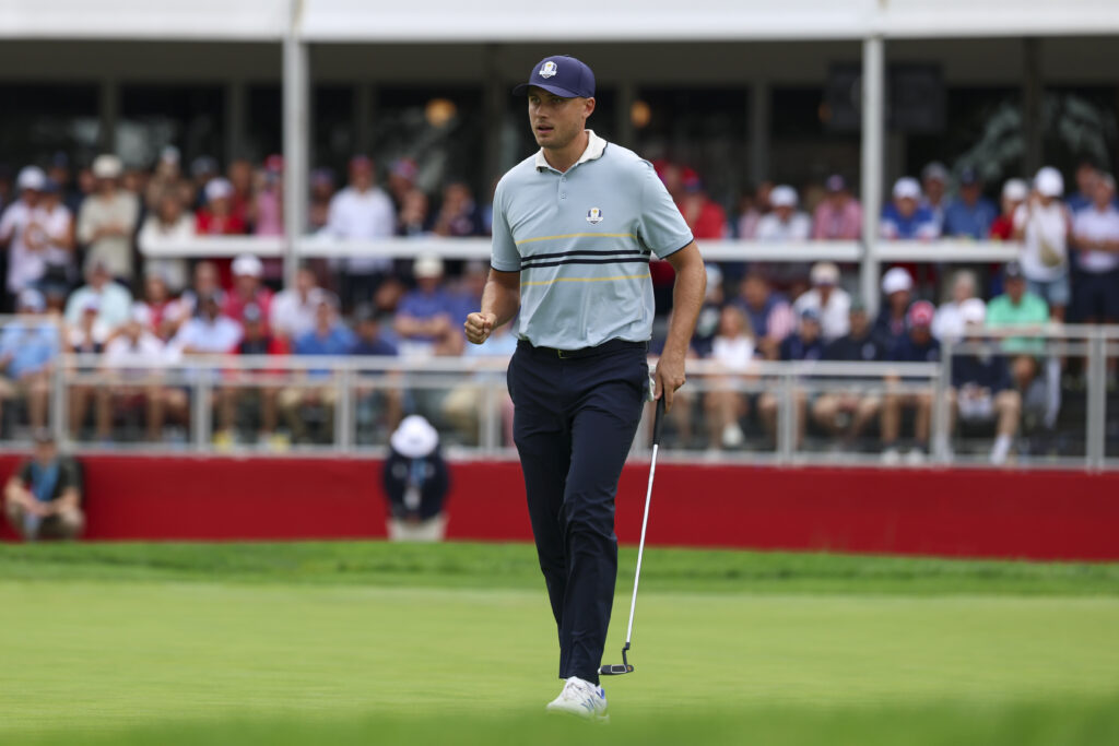 Ludvig Aberg of Team Europe reacts to making his putt on the ninth hole during the 2025 Ryder Cup.