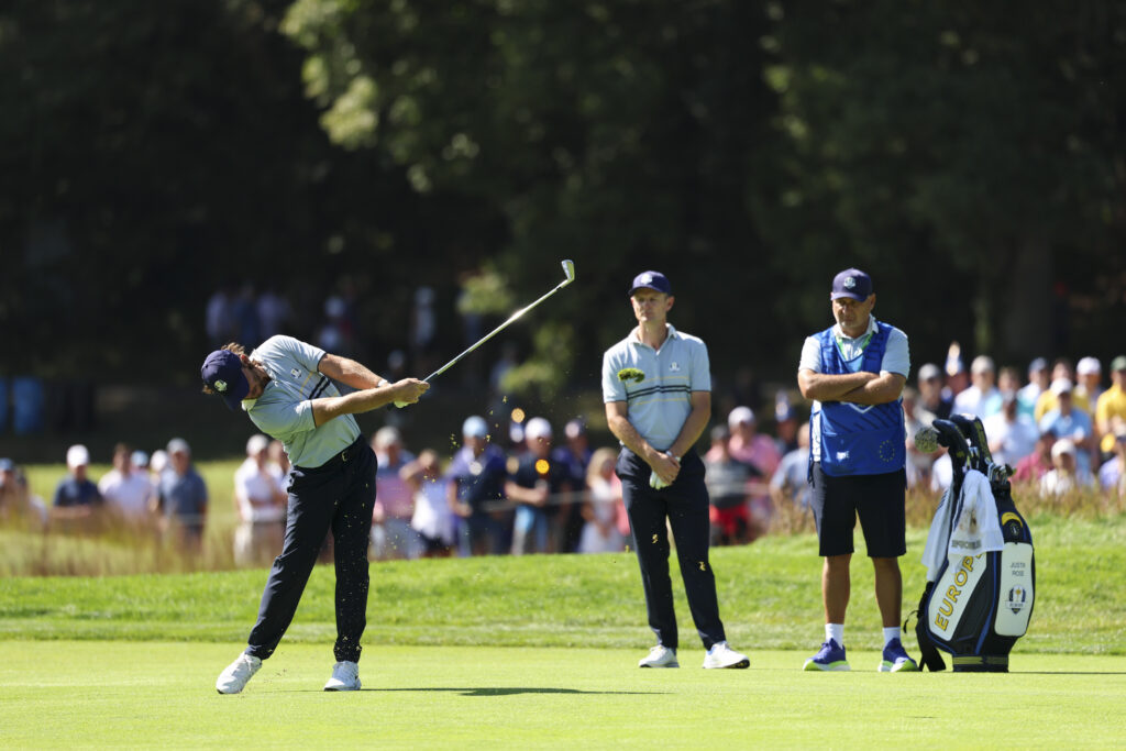 Tommy Fleetwood of Team Europe hits his shot on the fourth hole during the 2025 Ryder Cup.