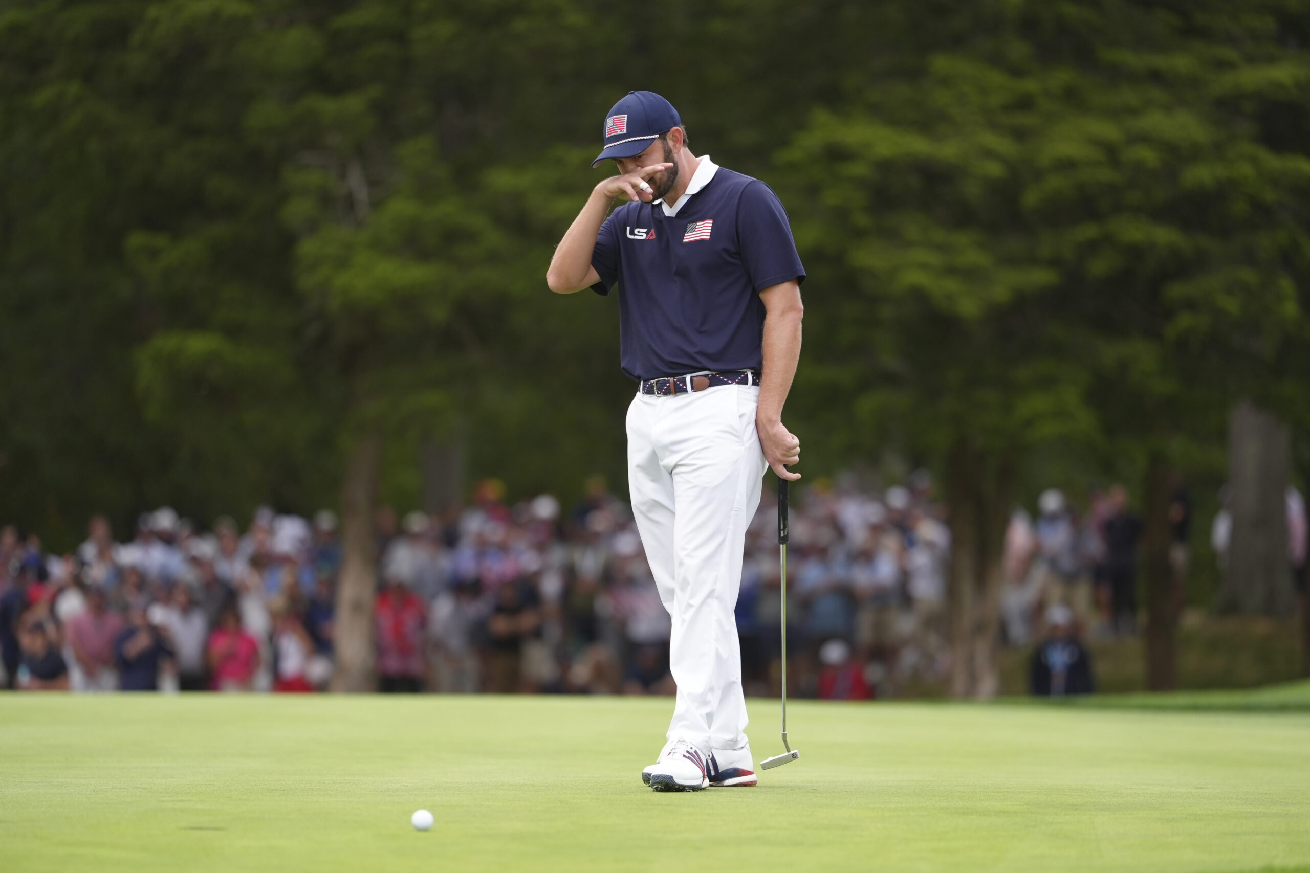 Patrick Cantlay of Team United States reacts to missing his putt on the 13th hole.