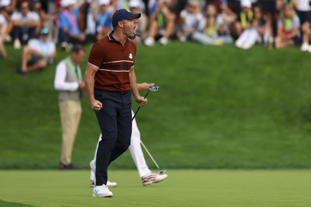 Rory McIlroy of Team Europe celebrates after making his putt on the 14th hole during the 2025 Ryder Cup.