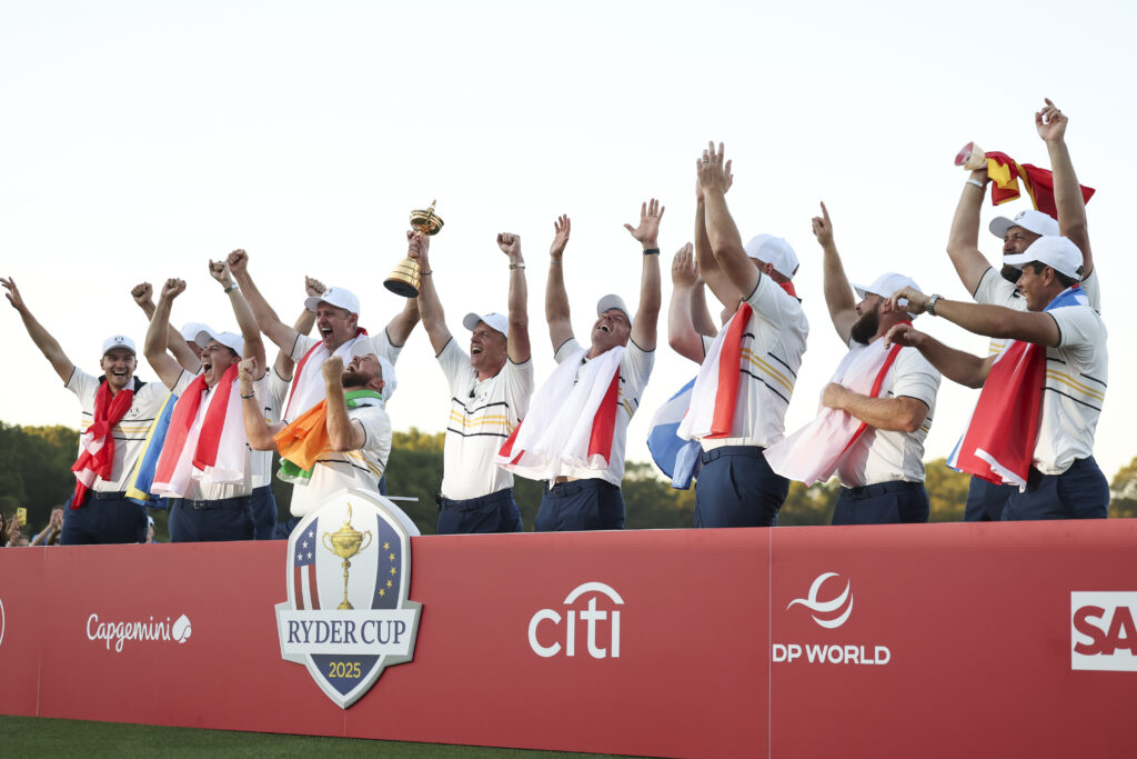 Team Europe (from left to right) Rasmus Hojgaard, Matt Fitzpatrick, Justin Rose, Shane Lowry, Luke Donald, Rory McIlroy, Ludvig Aberg, Tyrrell Hatton, Jon Rahm and Viktor Hovland celebrate with the trophy after winning the 2025 Ryder Cup.