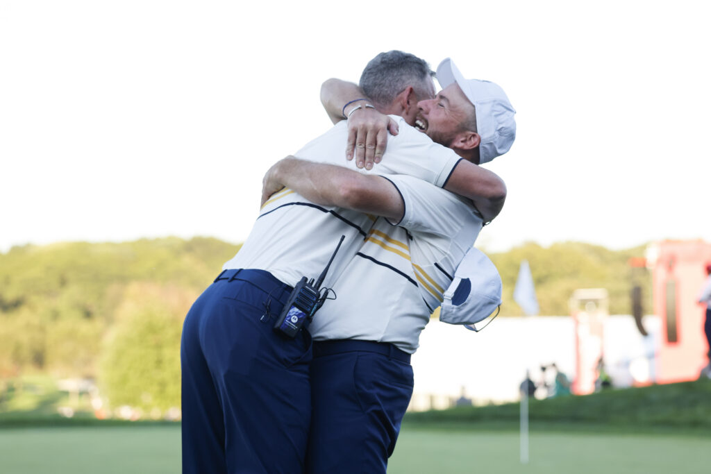 Team Europe Captain Luke Donald celebrates with Shane Lowry after retaining the cup with Lowry's putt on 18.