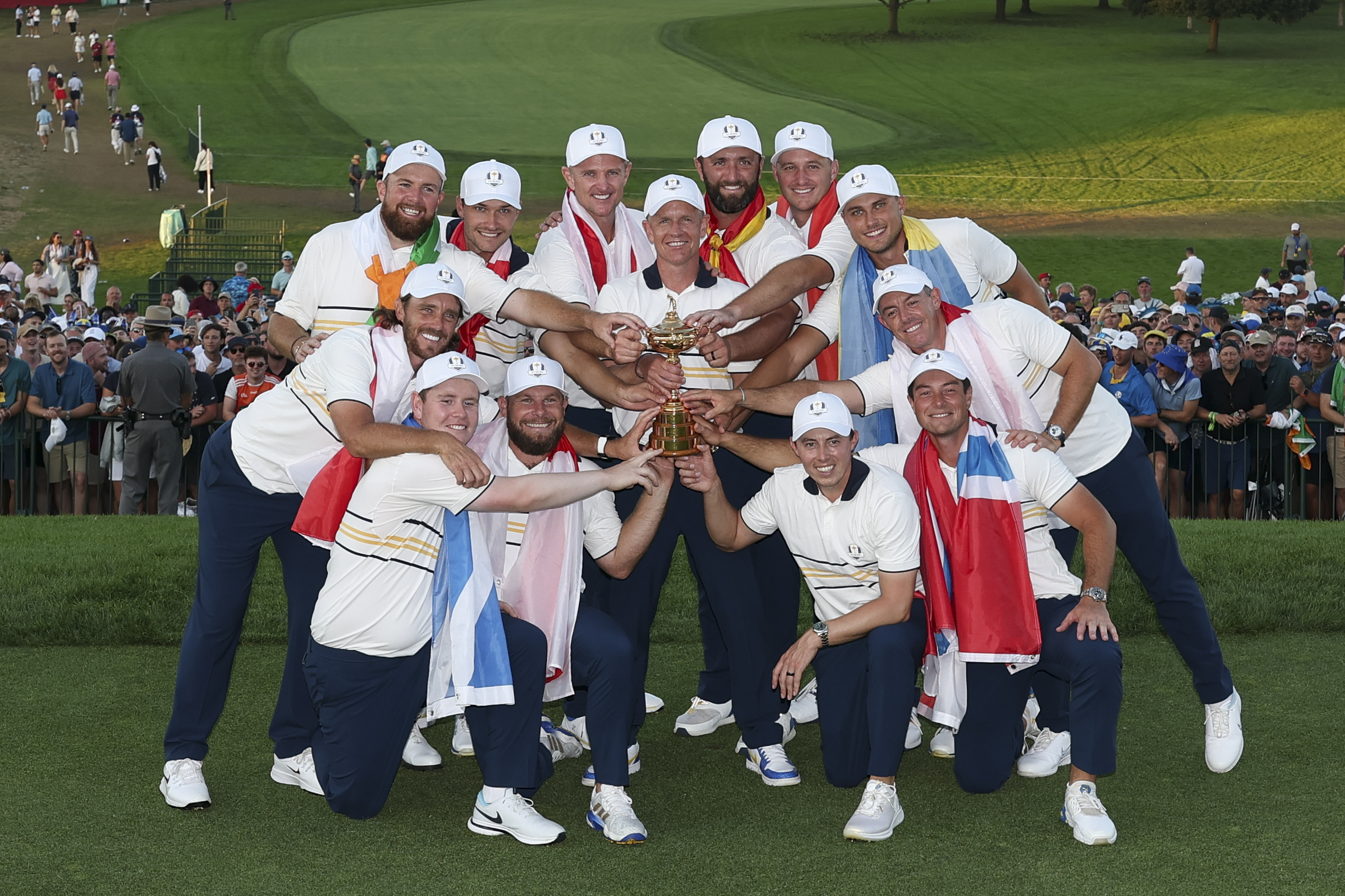 Shane Lowry, Tommy Fleetwood, Robert MacIntyre, Rasmus Hojgaard, Tyrrell Hatton, Justin Rose, Captain Luke Donald, Jon Rahm, Sepp Straka, Matt Fitzpatrick, Ludvig Aberg, Rory McIlroy and Viktor Hovland of Team Europe pose with the Ryder Cup after winning the 2025 Ryder Cup on the Black Course at Bethpage.