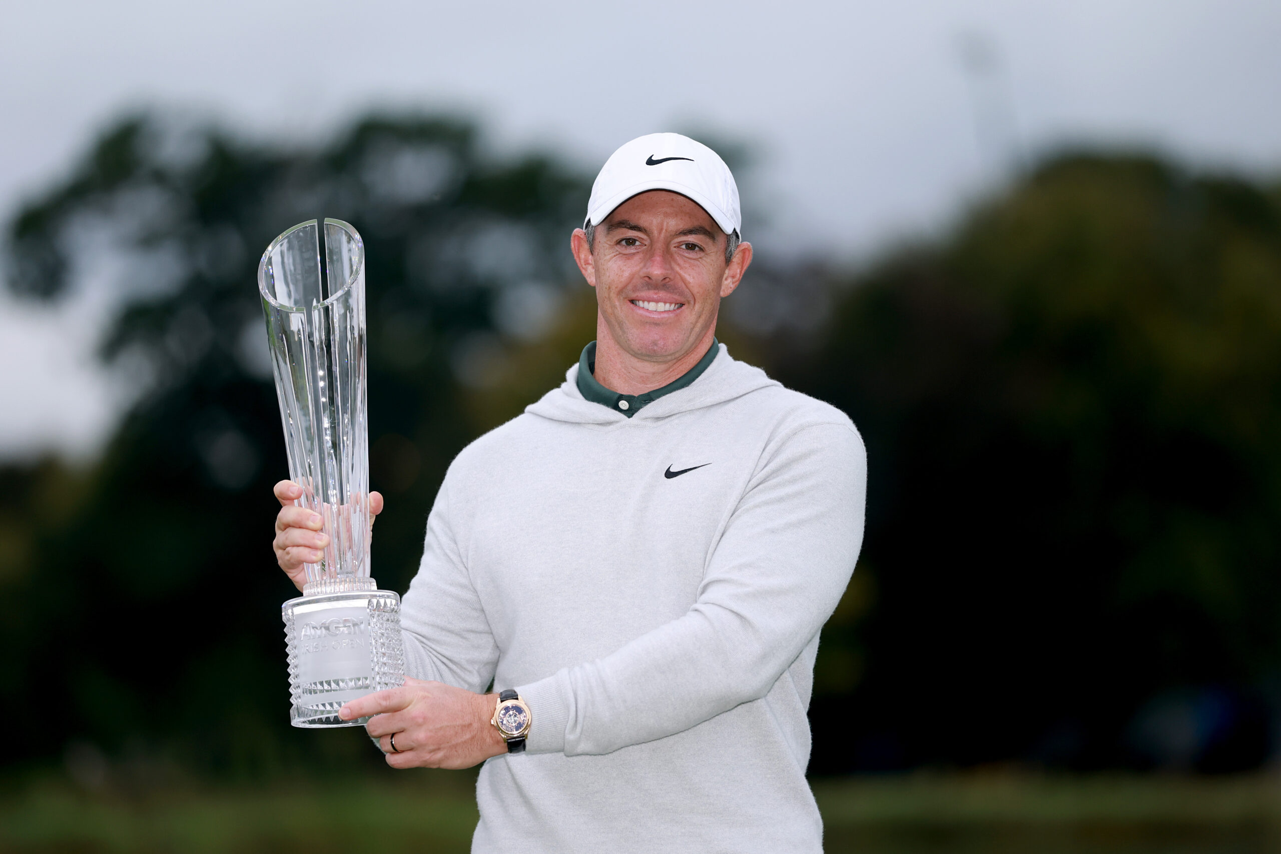 Rory McIlroy poses with the trophy after winning the Amgen Irish Open in a playoff.