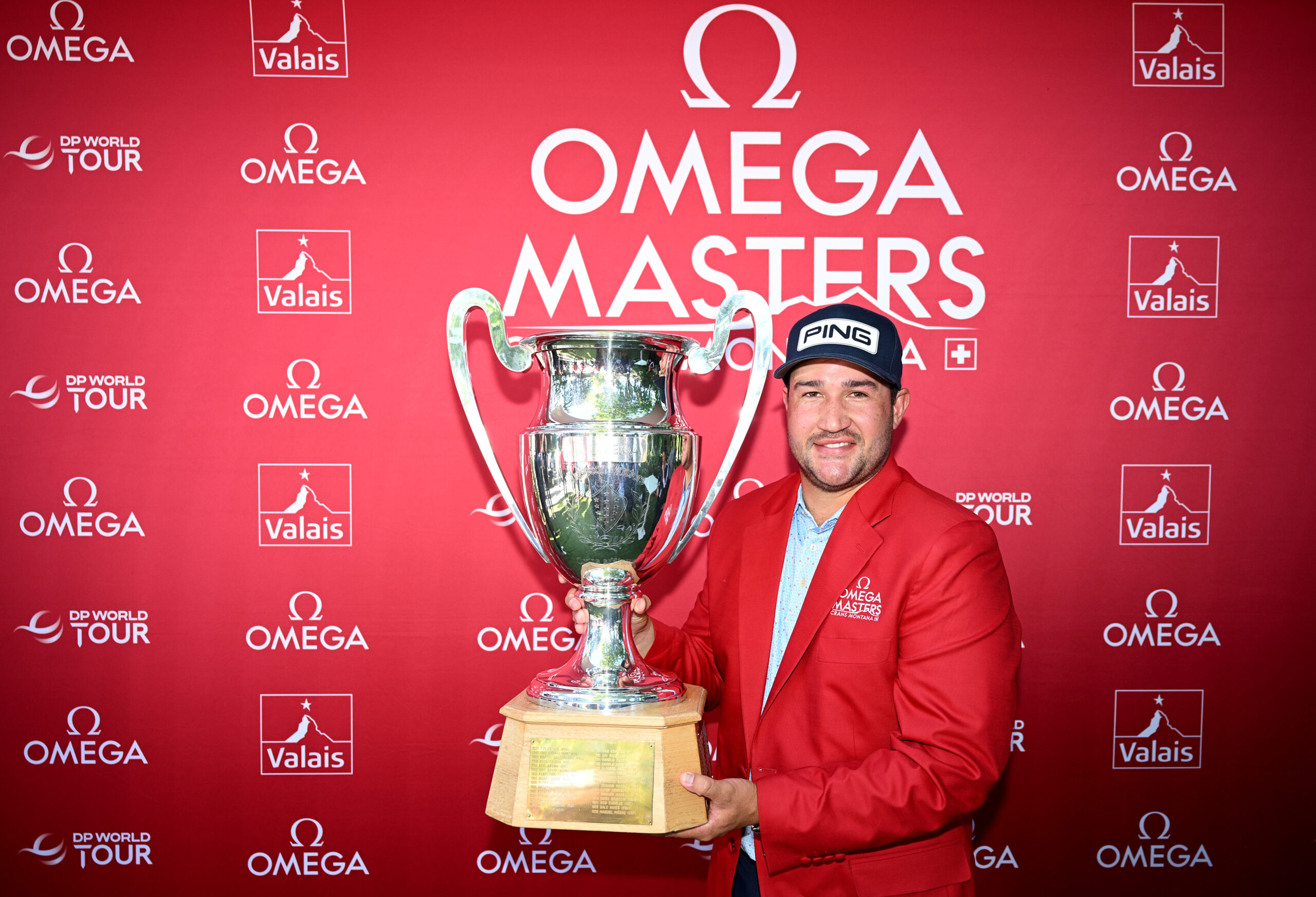 Thriston Lawrence of South Africa poses with the trophy following his victory on day four of the 2025 Omega European Masters.