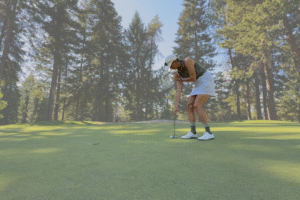 Brittany Bomar, co-founder and CEO of Bomar Putting Company, demonstrates side-saddle putting.