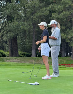 Brittany and Billy Bomar, co-founders of Bomar Putting Company, enjoy some time on the putting green. 