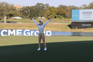 Jeeno Thitikul raises her hands after sinking a birdie putt on hole 18 and securing her win at the 2025 CME Group Tour Championship.