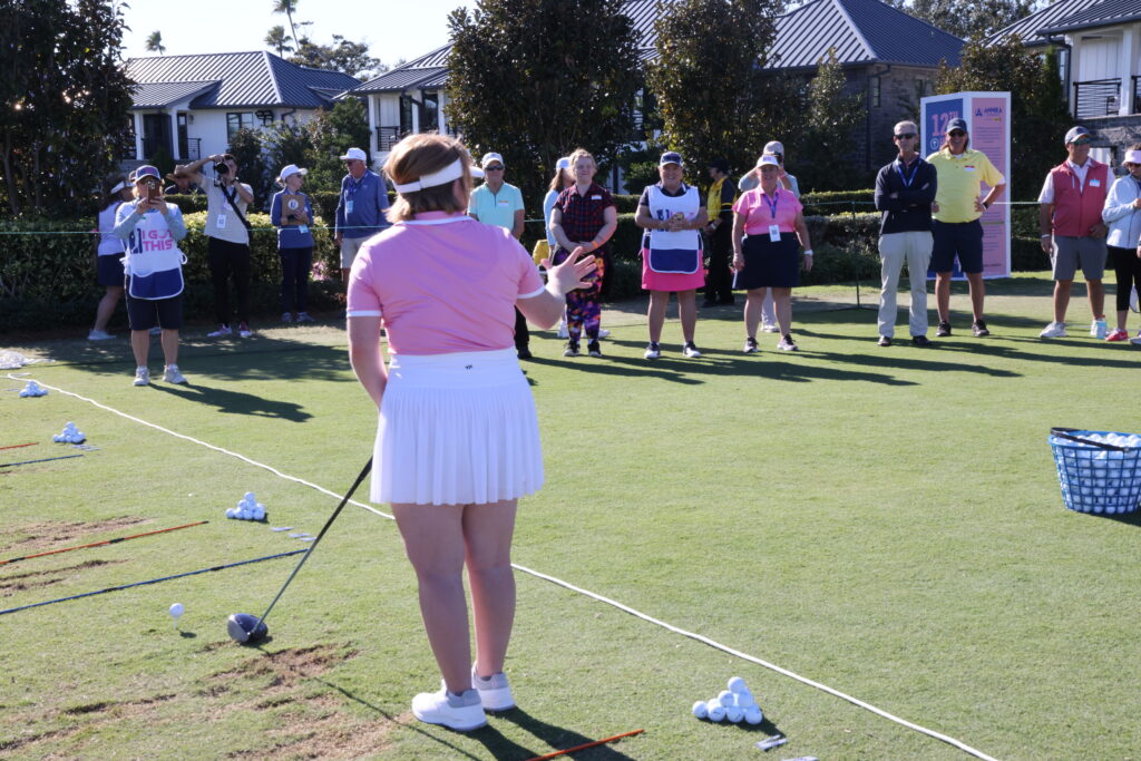 Amy Bockerstette welcomes her newest clinic group with a driver demo.