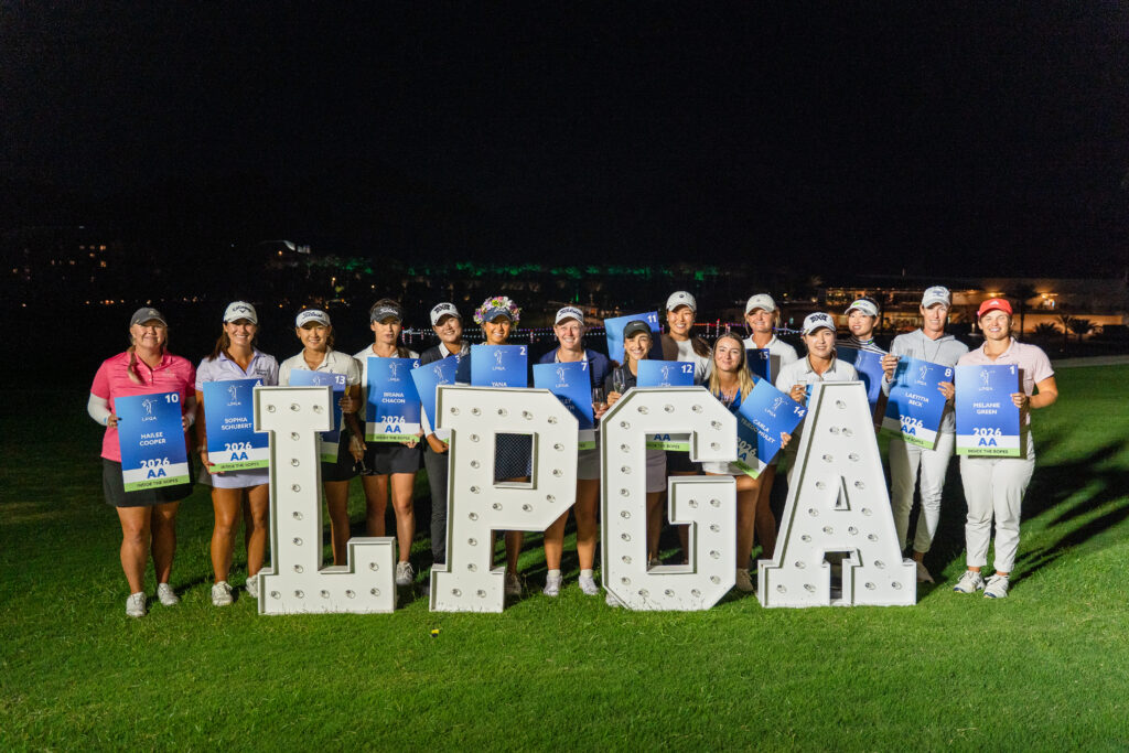 The 2025 Epson Tour graduates pose with their cards after the Epson Tour Championship.