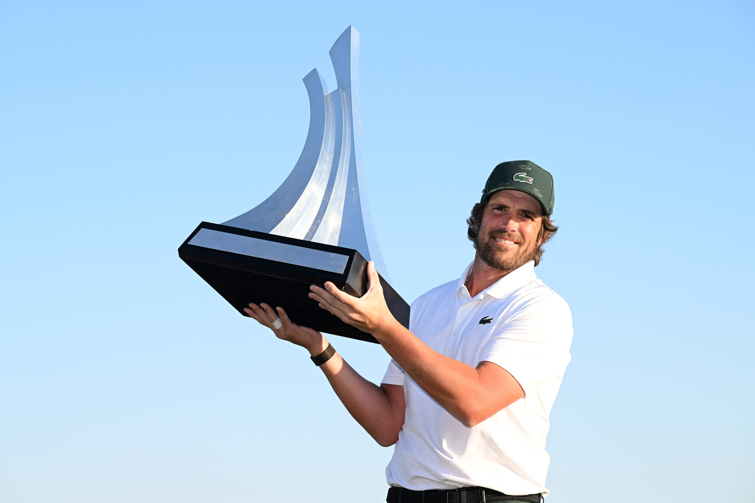 Nacho Elvira of Spain poses for a photo with the trophy at the 2026 Dubai Invitational.