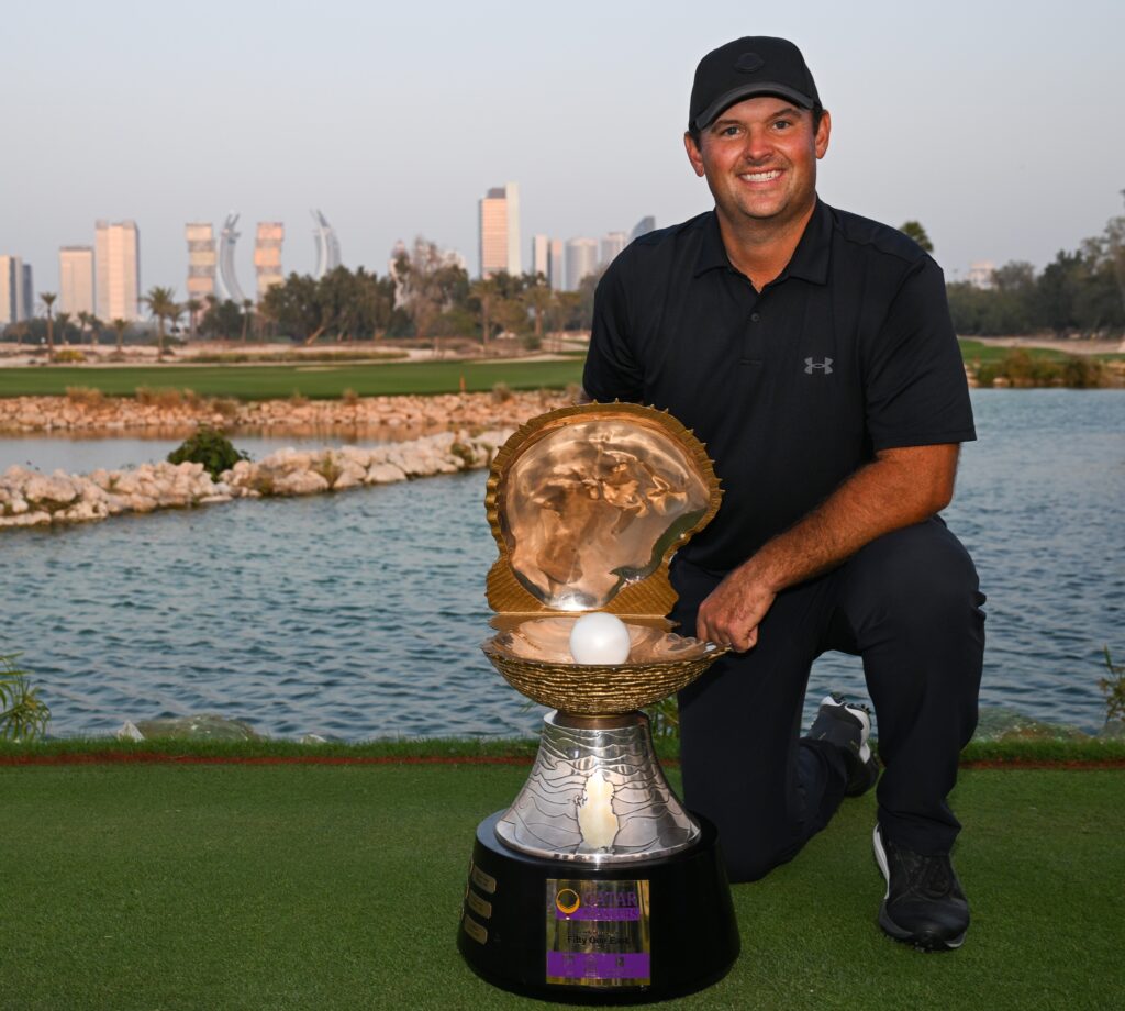 Patrick Reed hoists his second trophy this season.