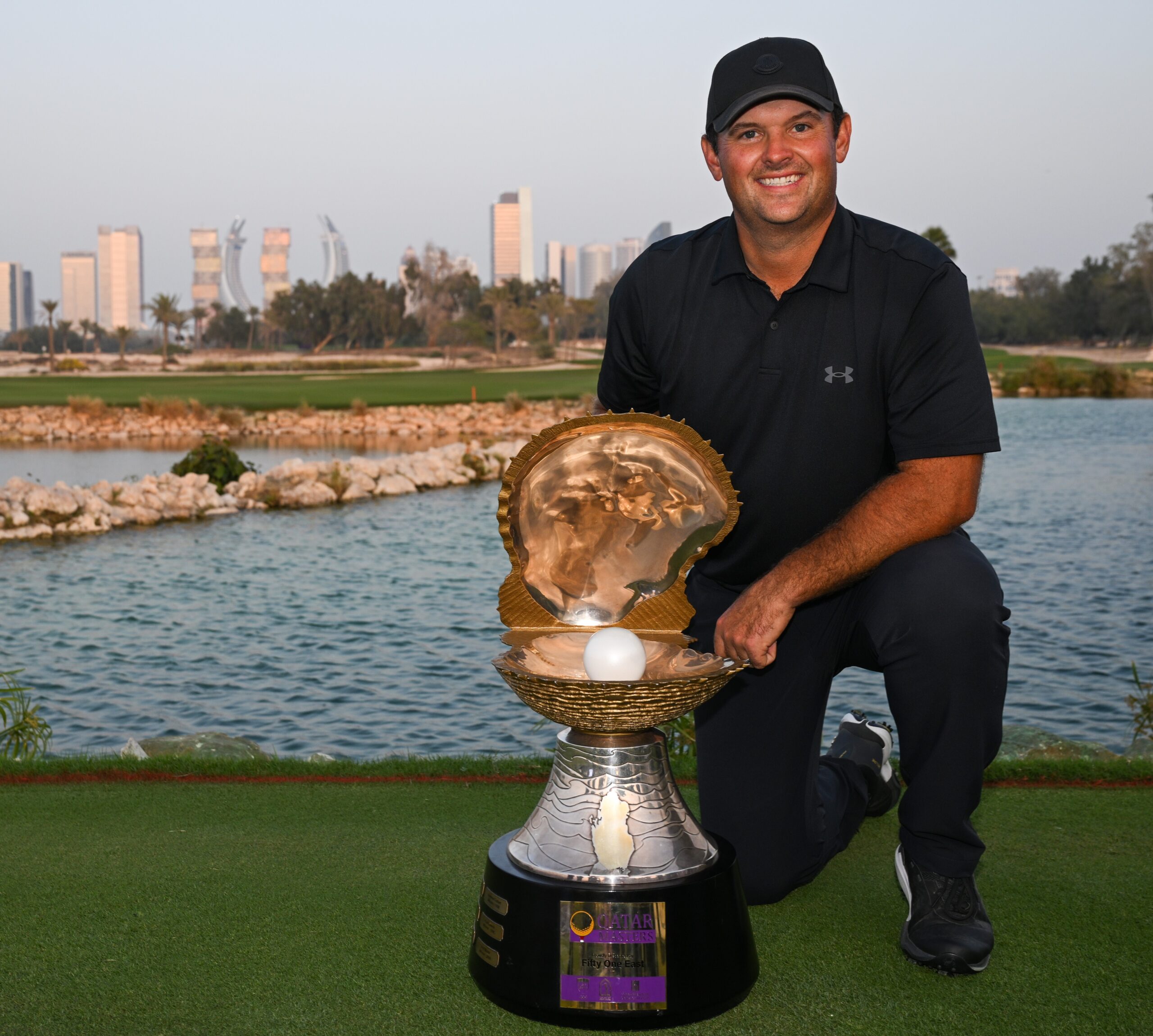 Patrick Reed hoists his second trophy this season.